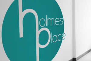 Holmes Place logo on wall